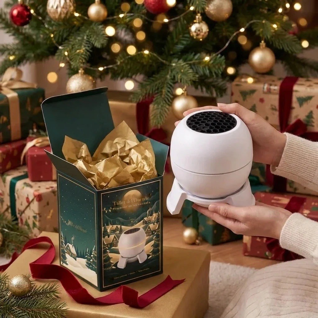 Taking the Taller del Duende projector out of its gift box next to the Christmas tree